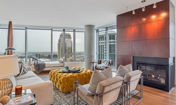 Modern living room with fireplace overlooking the city