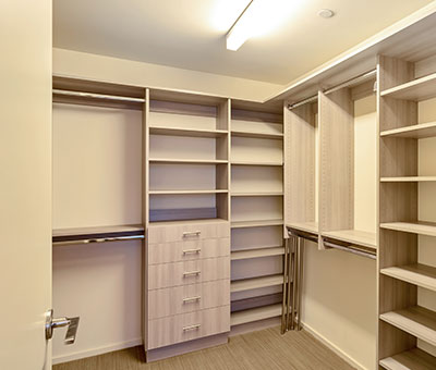 walk in closet with lots of shelves and space